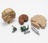 Wooden puzzle pieces and the cobra scroll guide system for Sabre bandsaws on a white background