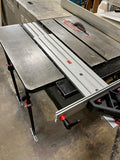 Aluminum sliding track system attached to a table saw